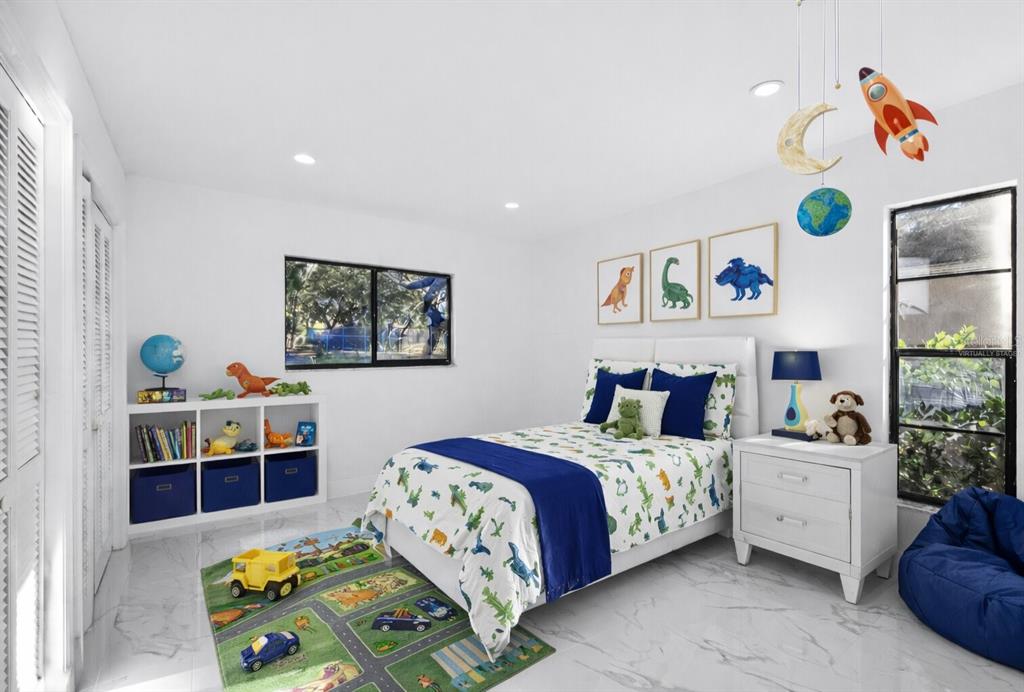 8078 Pagoda Drive Spring Hill, FL 34606 - Photo 6 of 54 a bedroom with a bed and dresser