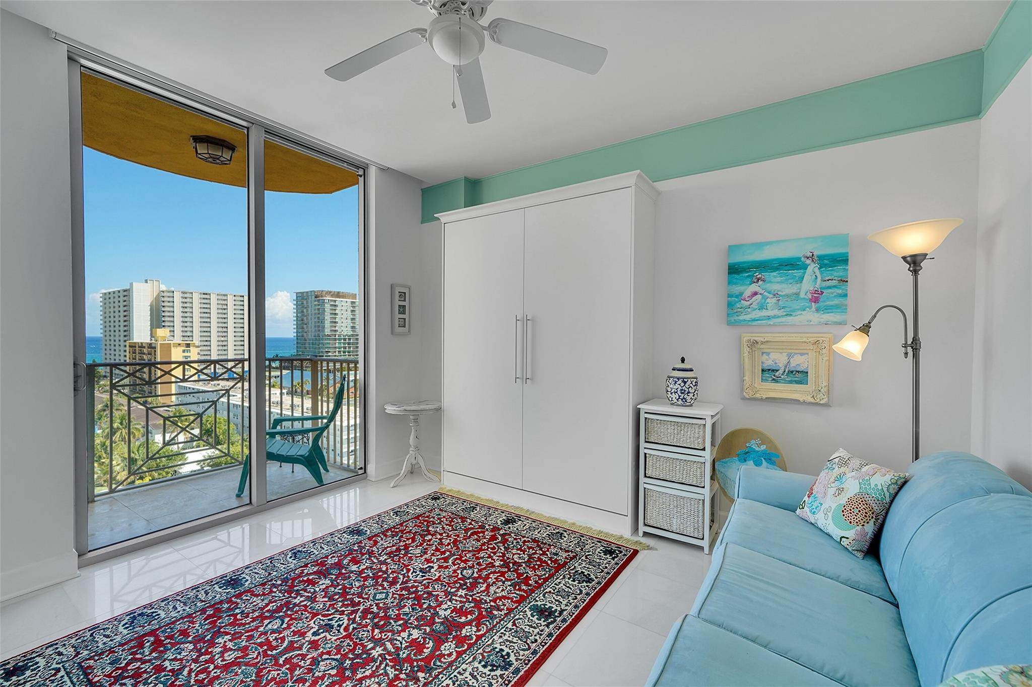 821 North Riverside Drive, Unit PH2 Pompano Beach, FL 33062 - Photo 59 of 95 a living room with furniture and a rug