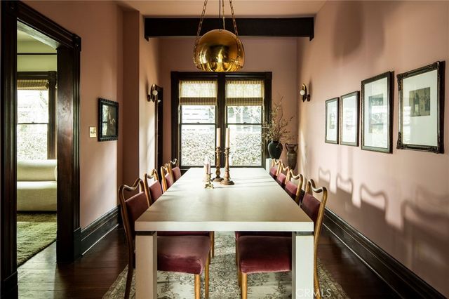 a dining room with a large window and table