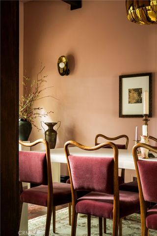 a view of a room with furniture and air conditioner vent