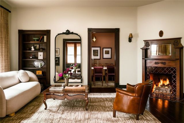 a living room with furniture and a fireplace