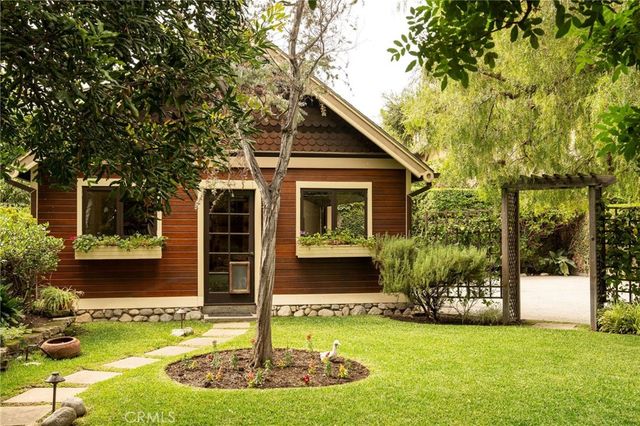 a house with swimming pool in front of it