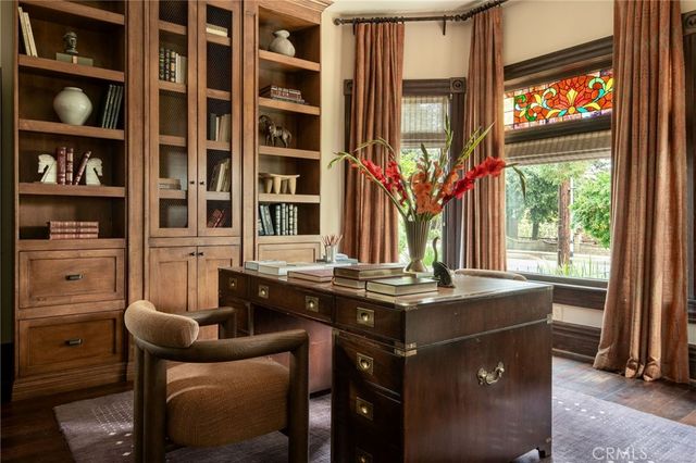 a dining room with furniture and a window