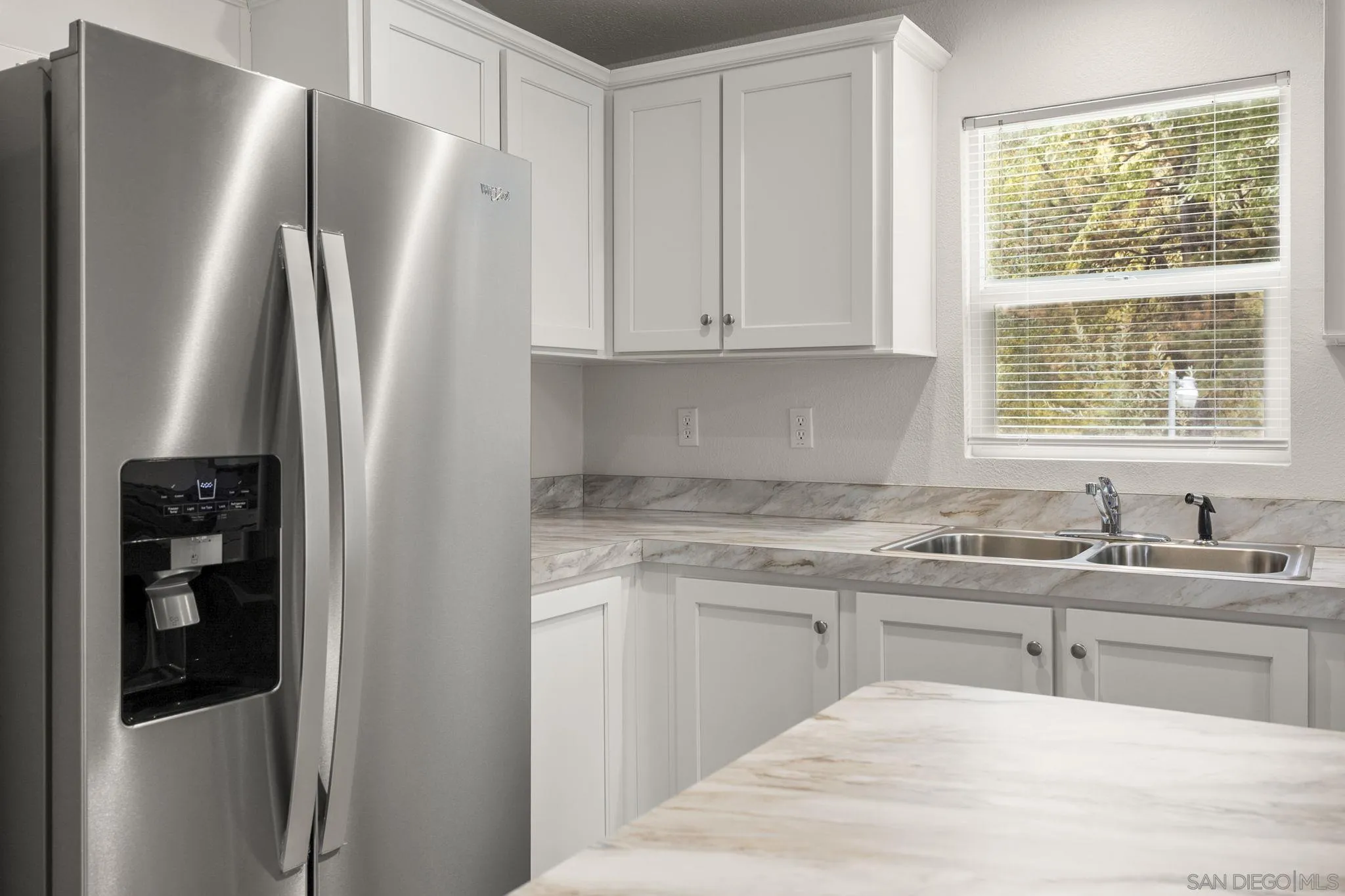 22899 Byron Road, Unit SPC 92 Crestline, CA 92325 - Photo 12 of 28 a kitchen with stainless steel appliances granite countertop a refrigerator and a sink
