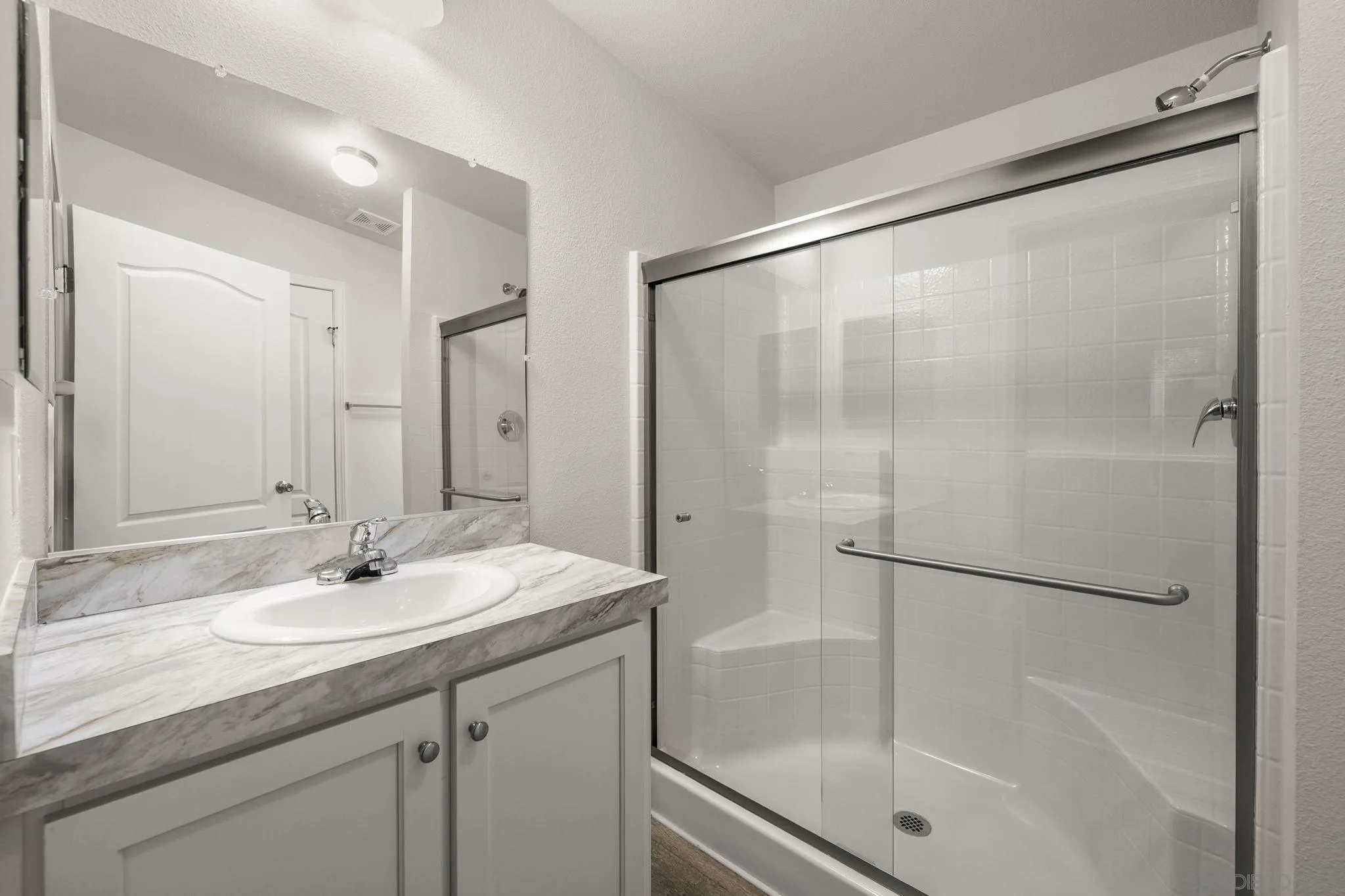 22899 Byron Road, Unit SPC 92 Crestline, CA 92325 - Photo 15 of 28 a bathroom with a shower sink vanity and mirror