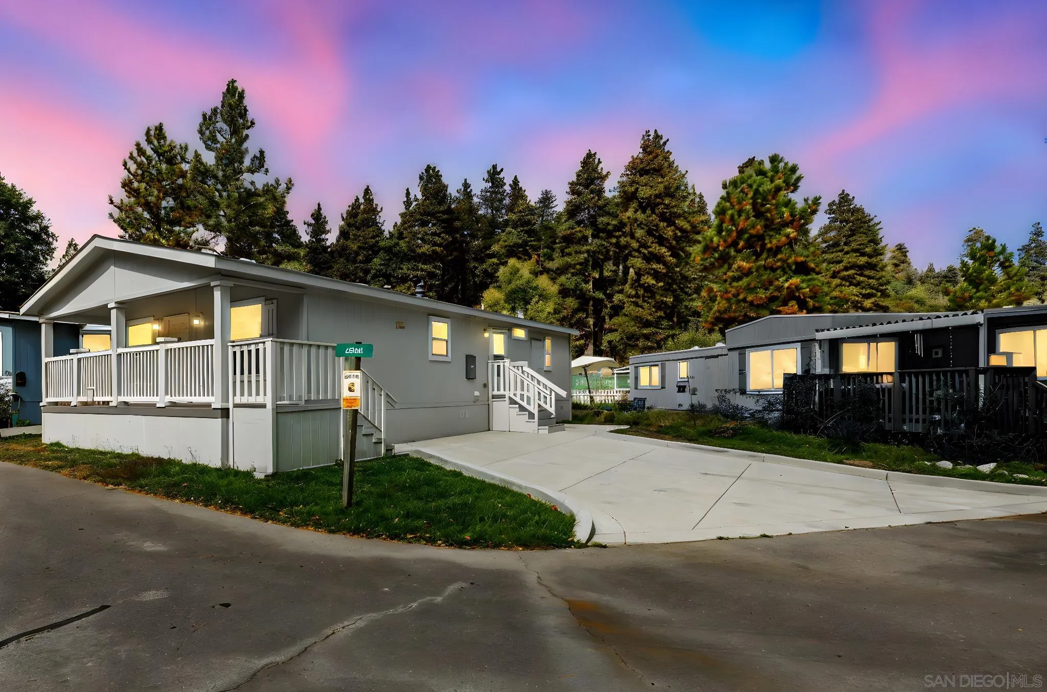 22899 Byron Road, Unit SPC 92 Crestline, CA 92325 - Photo 23 of 28 a front view of a house with a yard and garage