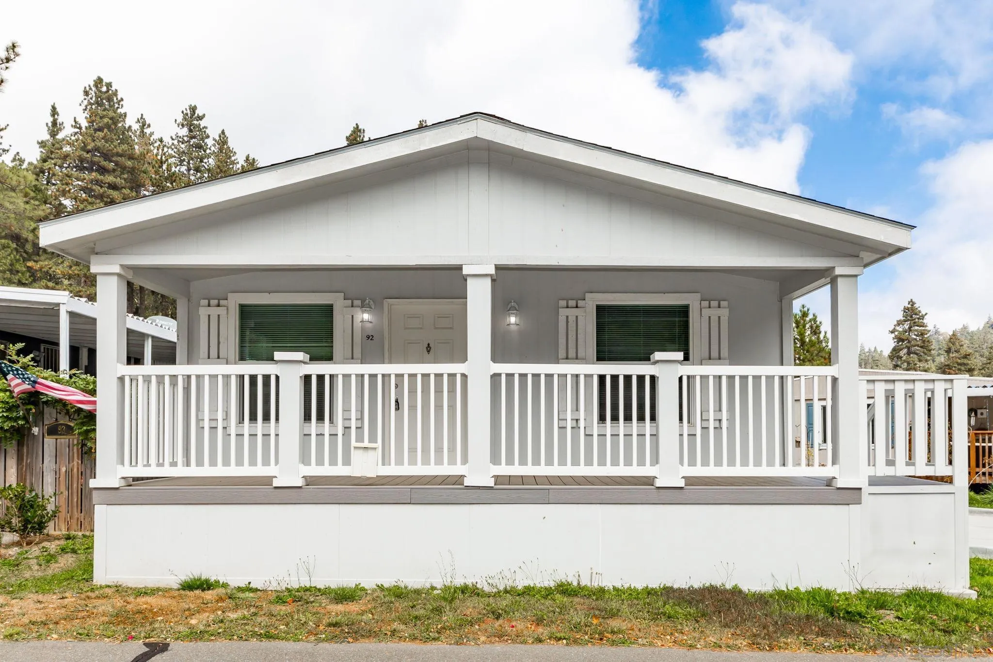 22899 Byron Road, Unit SPC 92 Crestline, CA 92325 - Photo 24 of 28 a front view of a house with a porch
