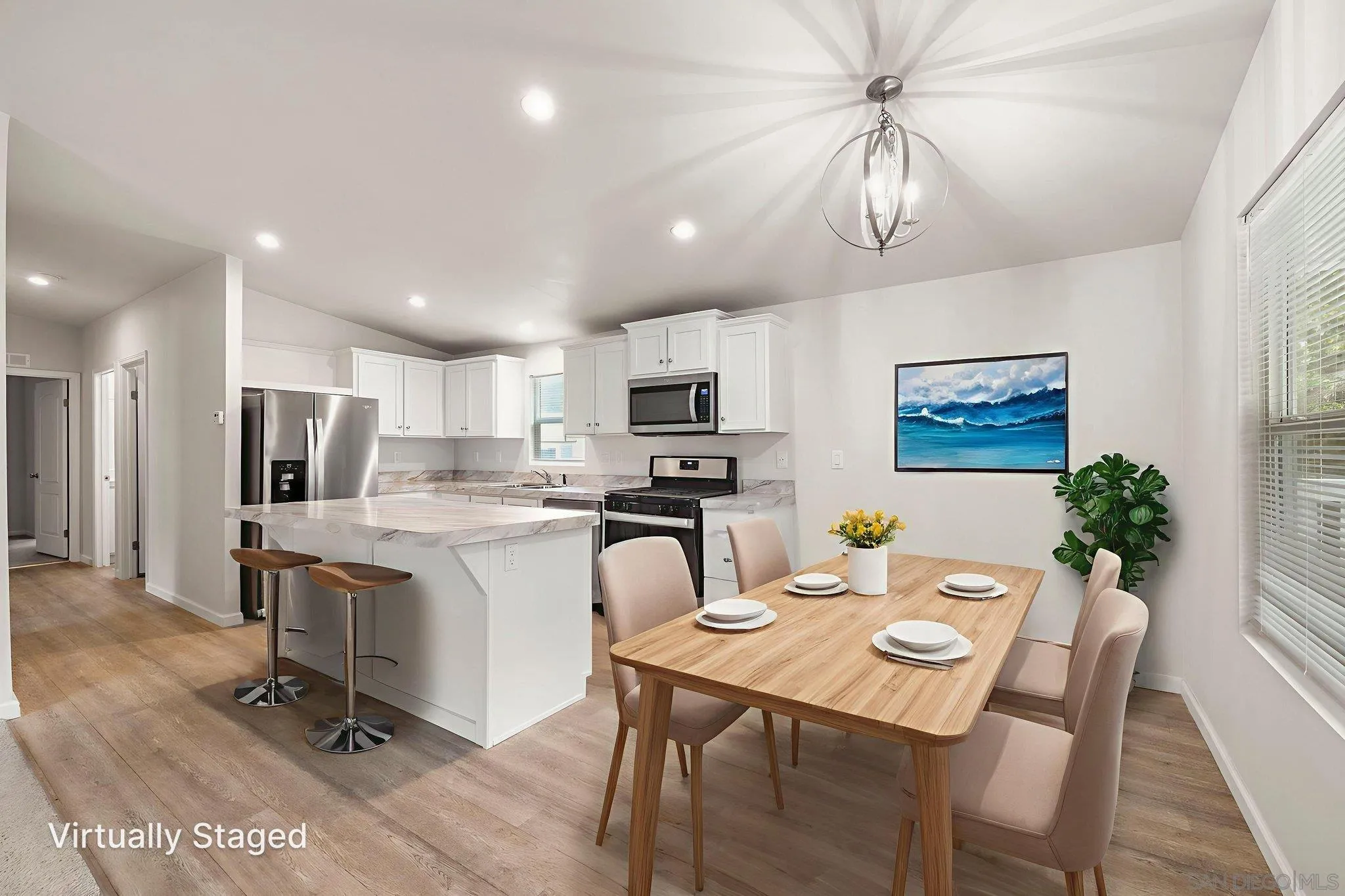 22899 Byron Road, Unit SPC 92 Crestline, CA 92325 - Photo 3 of 28 a view of a dining room with furniture a kitchen and chandelier