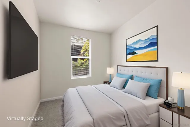 a bedroom with a bed and a potted plant