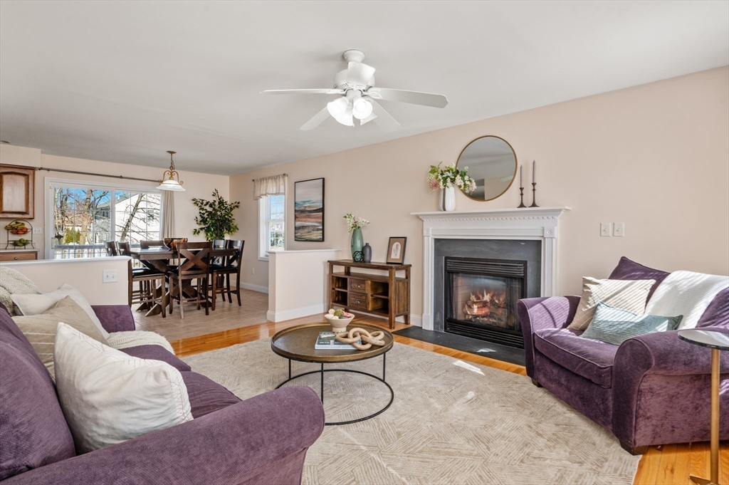 104 Overlook Terrace Dracut, MA 01826 - Photo 13 of 39 a living room with furniture and a fireplace