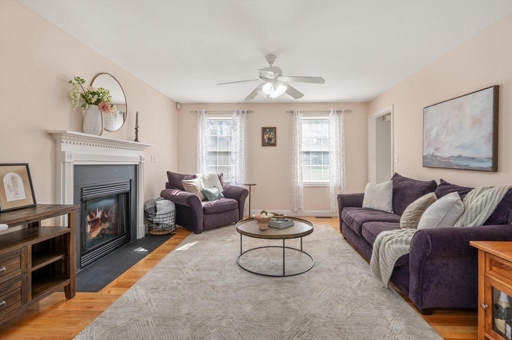 104 Overlook Terrace Dracut, MA 01826 - Photo 14 of 39 a living room with furniture and a fireplace