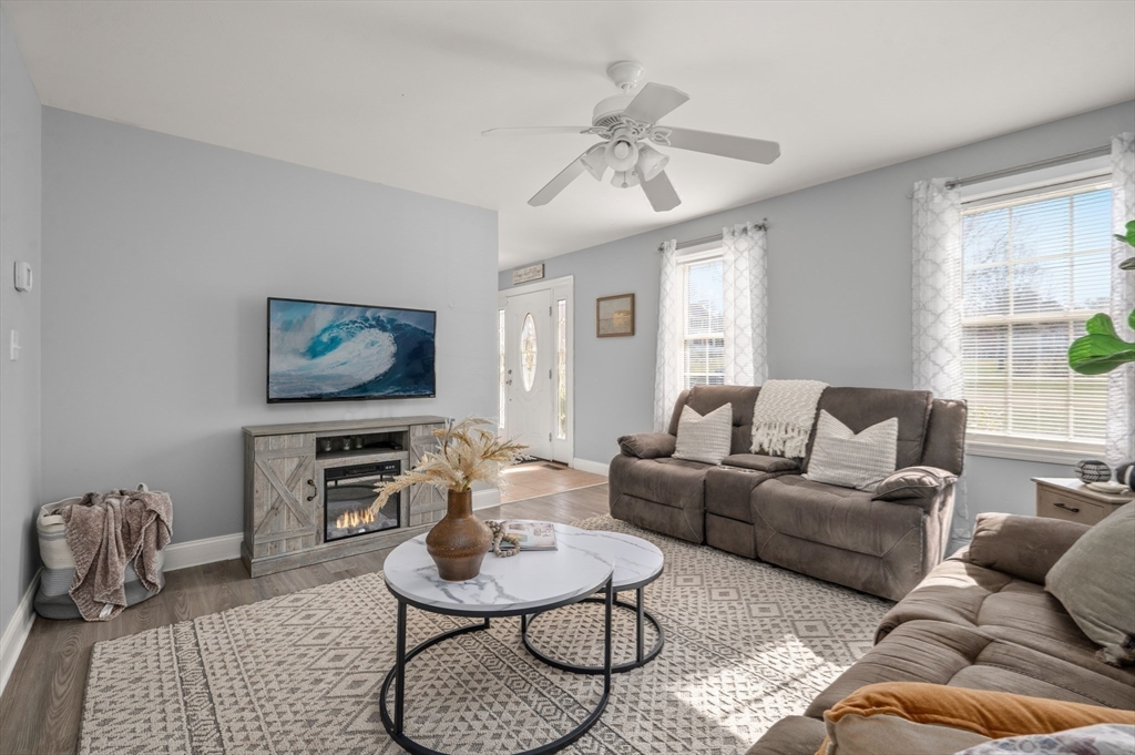 104 Overlook Terrace Dracut, MA 01826 - Photo 17 of 39 a living room with furniture a rug and a window