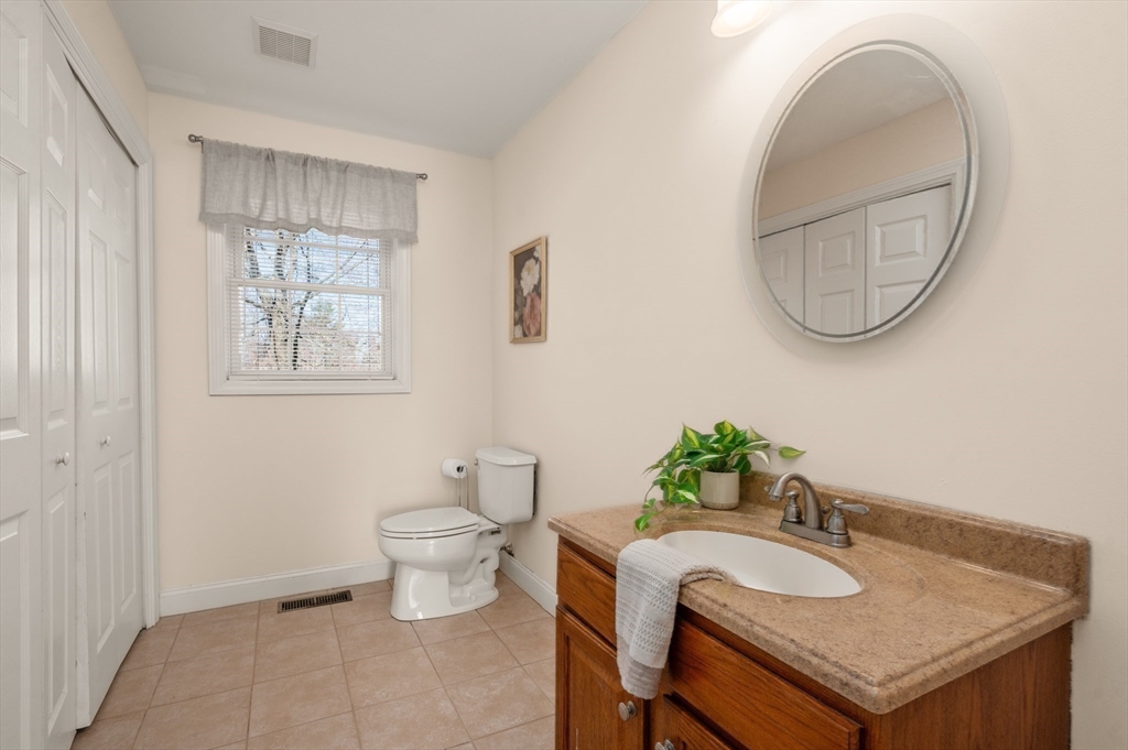 104 Overlook Terrace Dracut, MA 01826 - Photo 20 of 39 a bathroom with a sink and a toilet