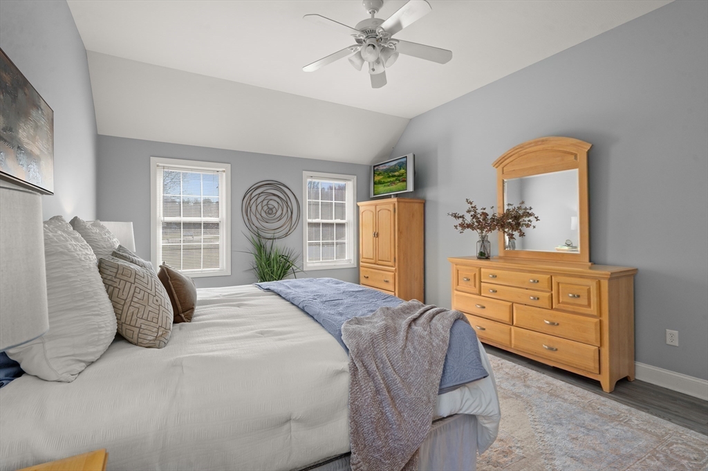 104 Overlook Terrace Dracut, MA 01826 - Photo 24 of 39 a bedroom with a bed and a dresser