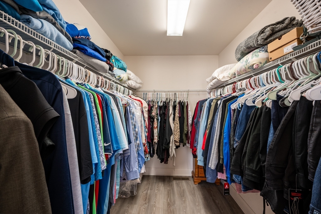 104 Overlook Terrace Dracut, MA 01826 - Photo 26 of 39 a view of walk in closet with clothes