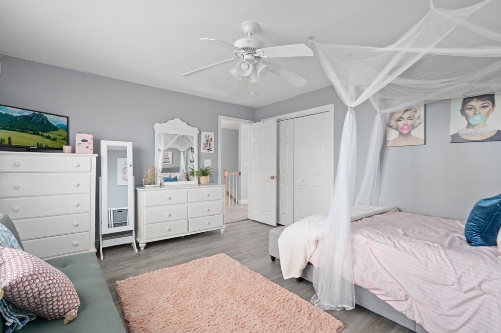 104 Overlook Terrace Dracut, MA 01826 - Photo 33 of 39 a bedroom with a white bed and dresser