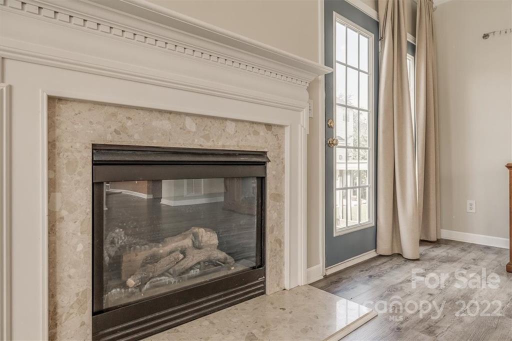 2126 Midnight Blue Lane Fort Mill, SC 29708 - Photo 14 of 35 a view of a living room that has a fireplace