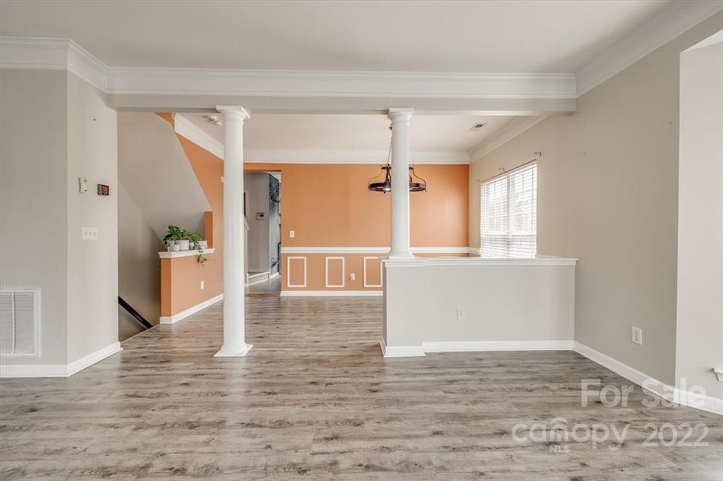 2126 Midnight Blue Lane Fort Mill, SC 29708 - Photo 15 of 35 a view of an empty room with wooden floor and a window