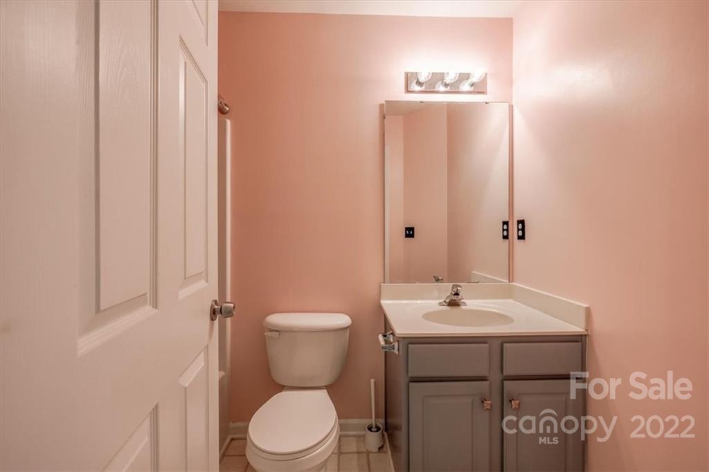 2126 Midnight Blue Lane Fort Mill, SC 29708 - Photo 28 of 35 a bathroom with a sink a toilet and mirror