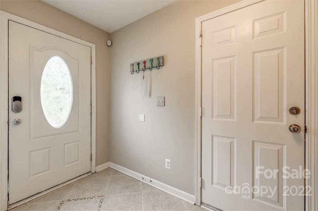 2126 Midnight Blue Lane Fort Mill, SC 29708 - Photo 4 of 35 an empty room with wooden floor and entryway