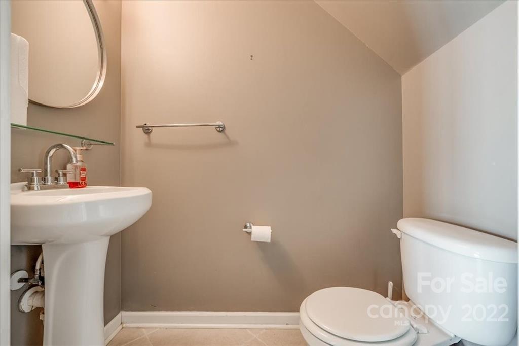 2126 Midnight Blue Lane Fort Mill, SC 29708 - Photo 6 of 35 a bathroom with a sink a mirror and a toilet