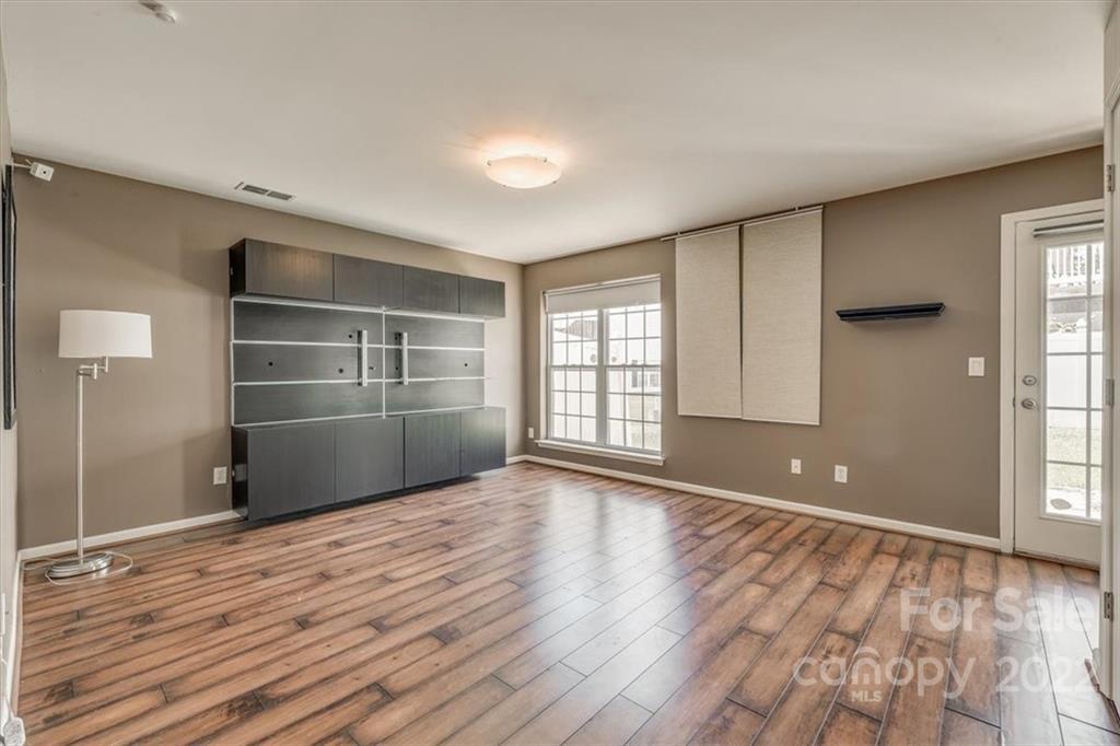 2126 Midnight Blue Lane Fort Mill, SC 29708 - Photo 7 of 35 a view of wooden floor and windows in a room