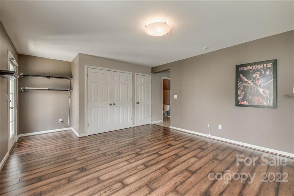 2126 Midnight Blue Lane Fort Mill, SC 29708 - Photo 9 of 35 a view of an empty room with wooden floor
