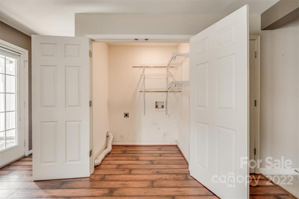 2126 Midnight Blue Lane Fort Mill, SC 29708 - Photo 10 of 35 a view of a hallway with wooden floor and staircase