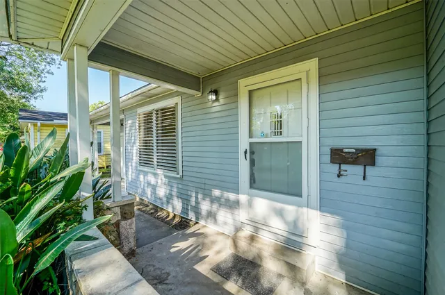 a view of a porch with wooden floor