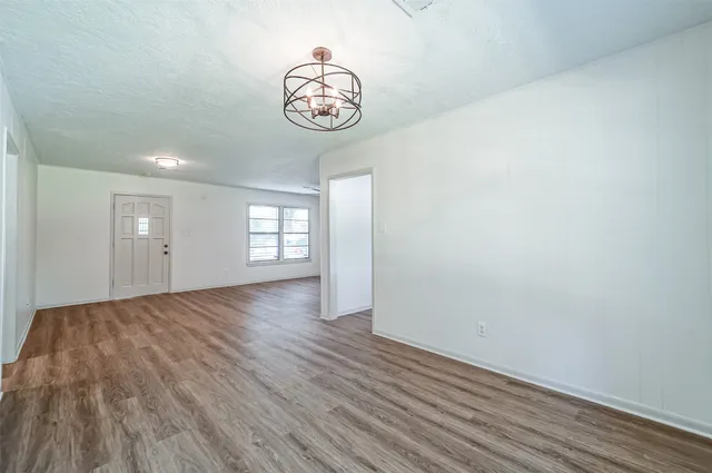 a view of an empty room and a window