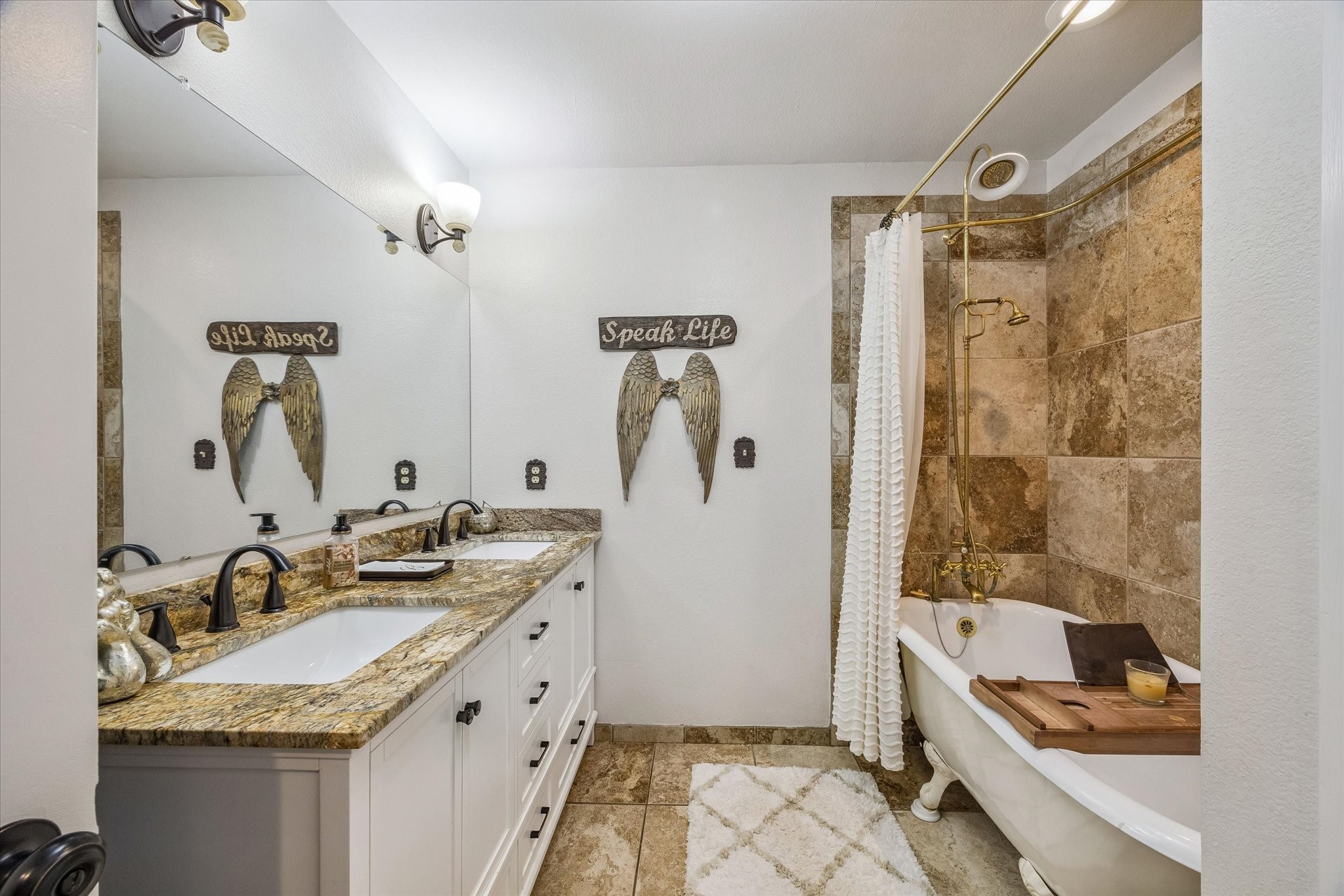 3515 County Road 36 Angleton, TX 77515 - Photo 29 of 50 a bathroom with a granite countertop sink and a mirror