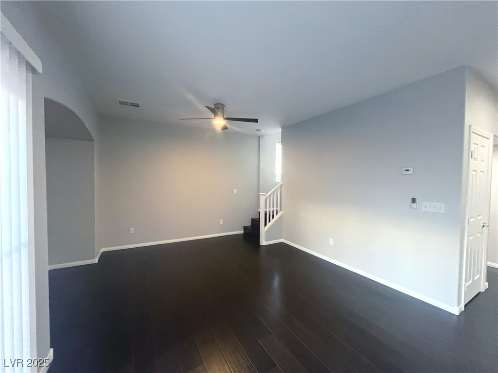 231 Spectacular Street Henderson, NV 89052 - Photo 16 of 66 Living room w/wood laminate flooring, ceiling fan & light & entertainment niche.