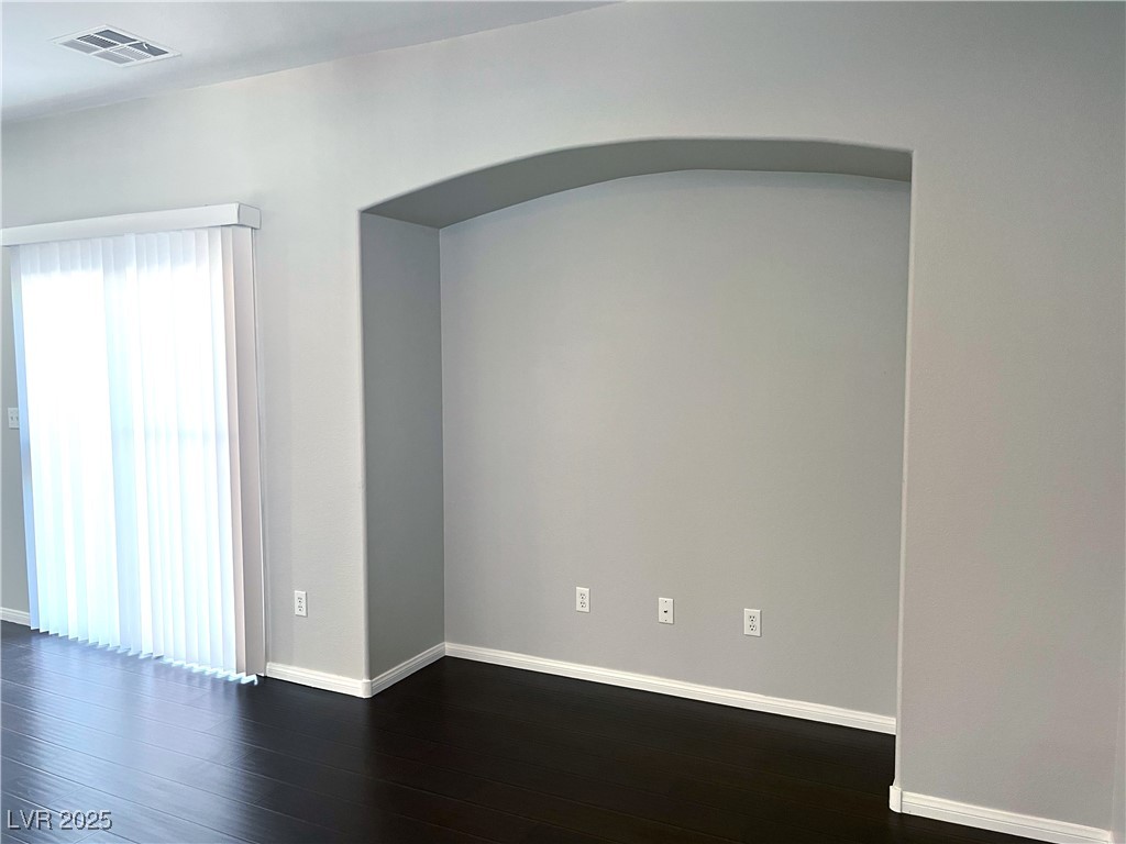 231 Spectacular Street Henderson, NV 89052 - Photo 19 of 66 Living room w/wood laminate flooring, ceiling fan & light & entertainment niche.
