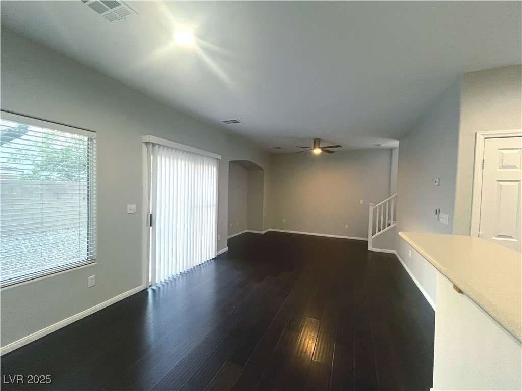 231 Spectacular Street Henderson, NV 89052 - Photo 22 of 66 Living room w/wood laminate flooring, ceiling fan & light & entertainment niche.