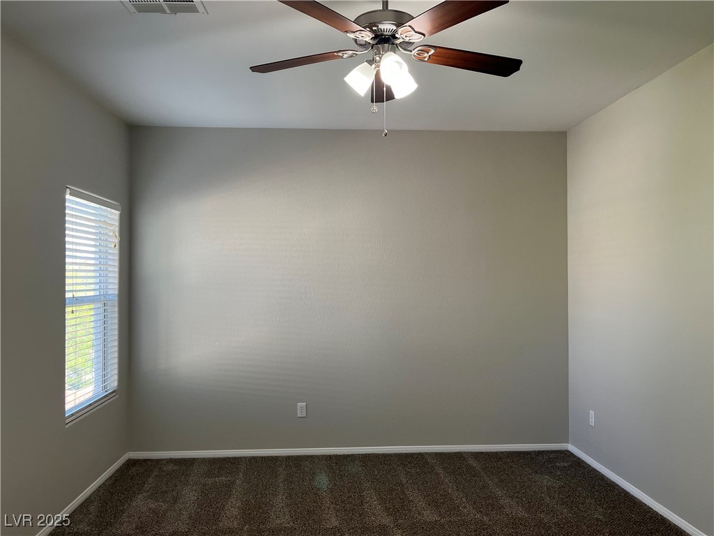 231 Spectacular Street Henderson, NV 89052 - Photo 26 of 66 Primary bed with carpet, ceiling fan and ceiling light and walk in closet