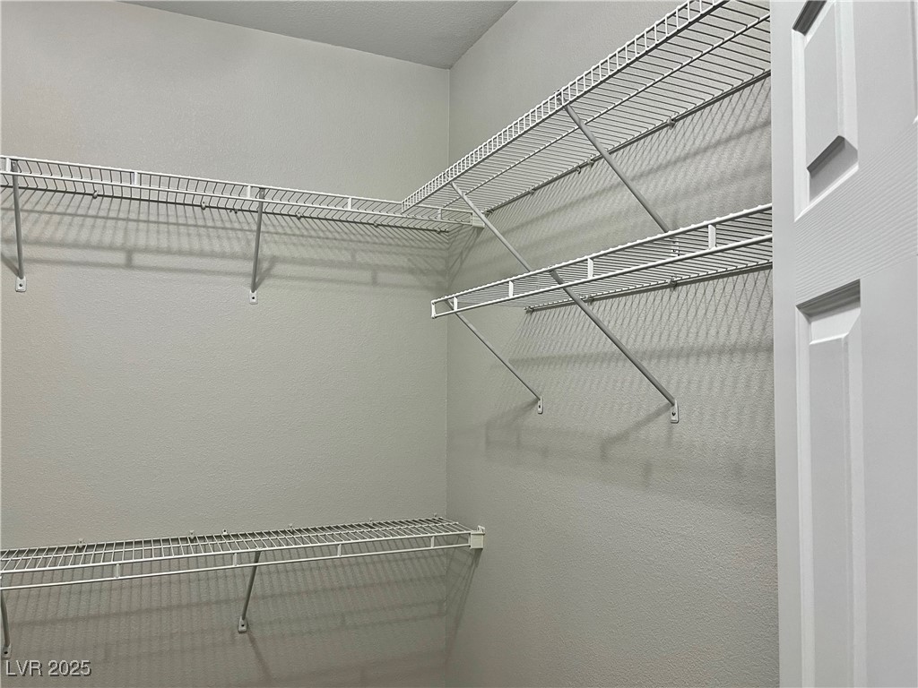 231 Spectacular Street Henderson, NV 89052 - Photo 32 of 66 Primary bedroom walk in closet