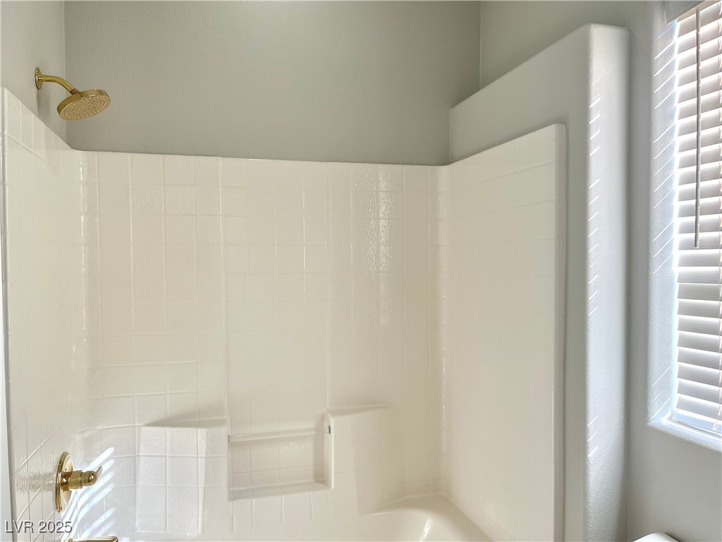 231 Spectacular Street Henderson, NV 89052 - Photo 46 of 66 Jack and Jill bath with double sink, cultured marble countertop, oak cabinets and shower/tub combo