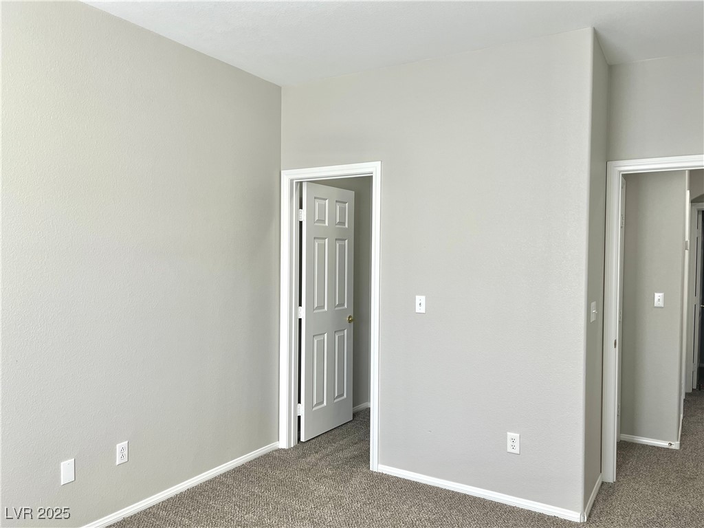 231 Spectacular Street Henderson, NV 89052 - Photo 49 of 66 Bed 3 with ceiling light, carpet, walk in closet and Jack and Jill bathroom