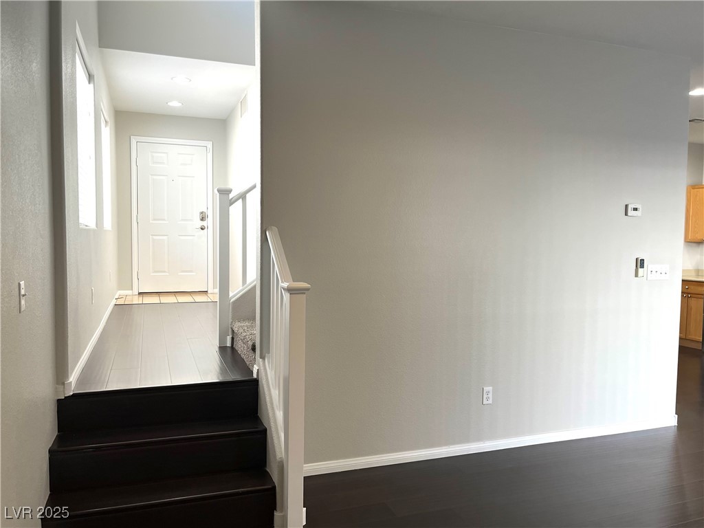 231 Spectacular Street Henderson, NV 89052 - Photo 63 of 66 Step up from livingroom to entry