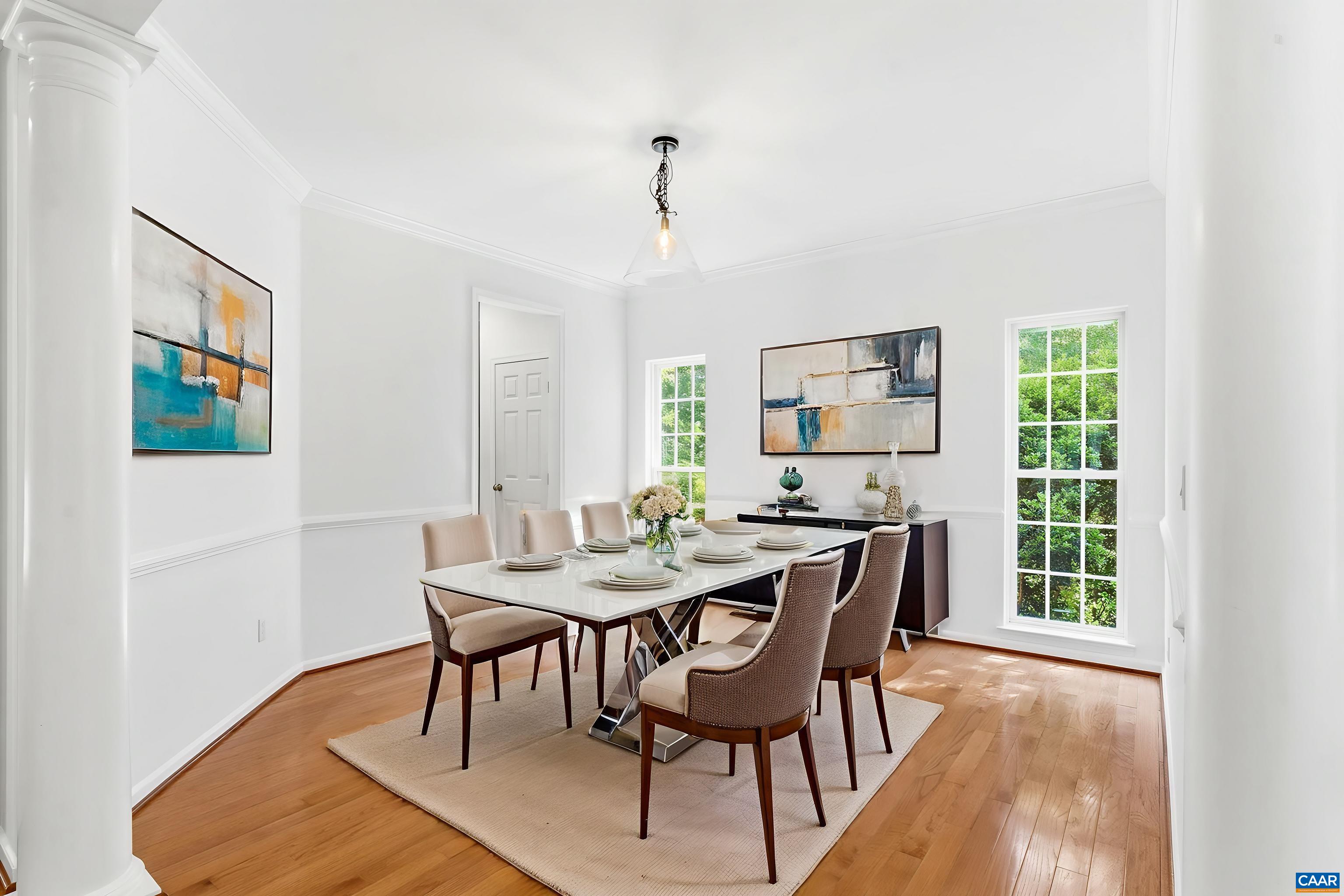 700 Rainier Road Charlottesville, VA 22903 - Photo 12 of 41 Dedicated dining space with hardwood floors, tall windows, and easy access to the kitchen, ready to entertain.