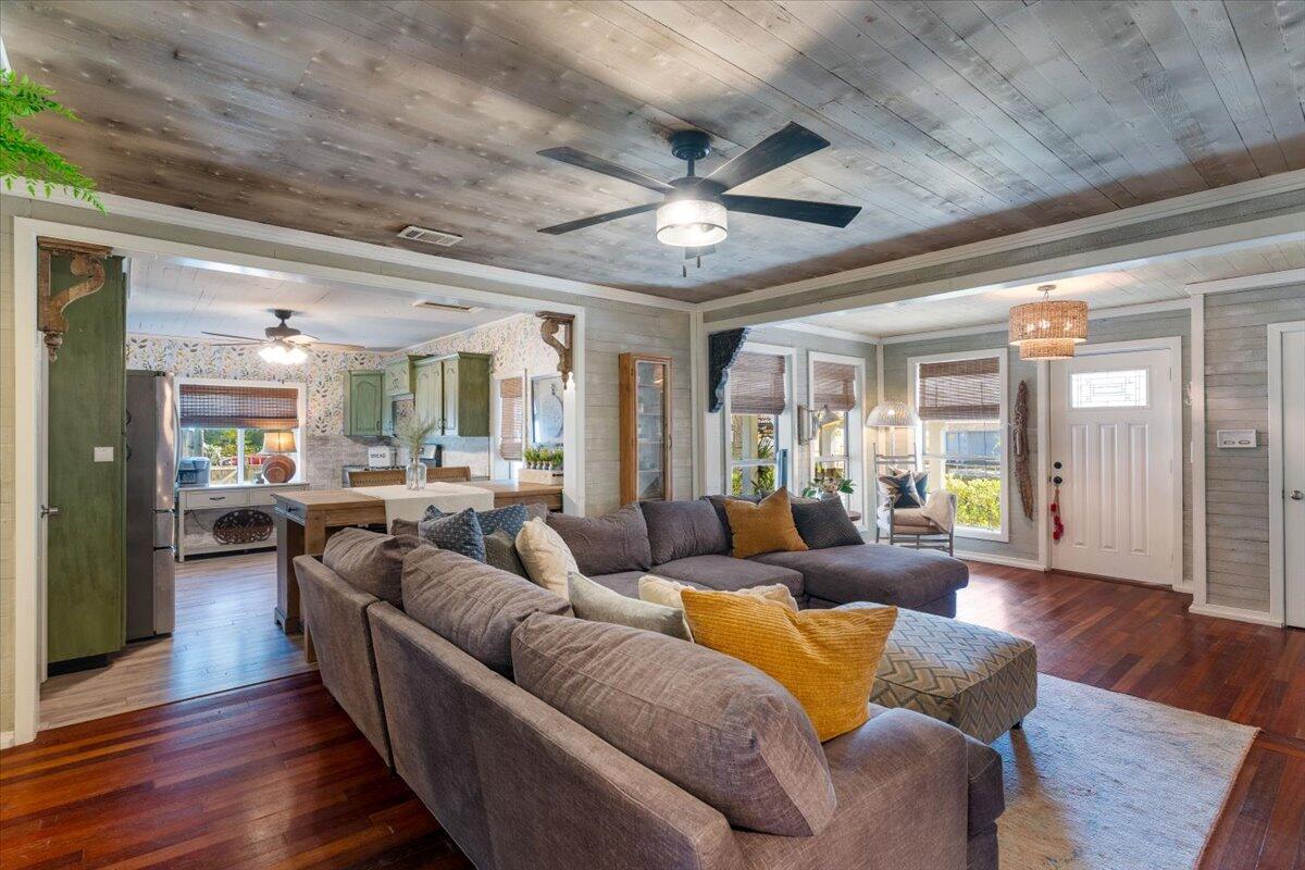 3562 Bob Tolbert Road Navarre, FL 32566 - Photo 11 of 55 a living room with furniture and wooden floor