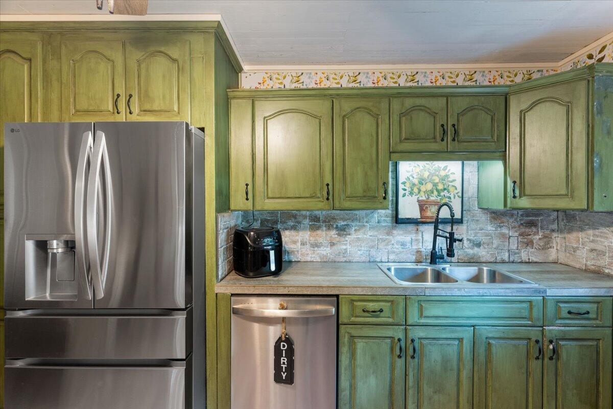 3562 Bob Tolbert Road Navarre, FL 32566 - Photo 14 of 55 a bathroom with a sink and a mirror