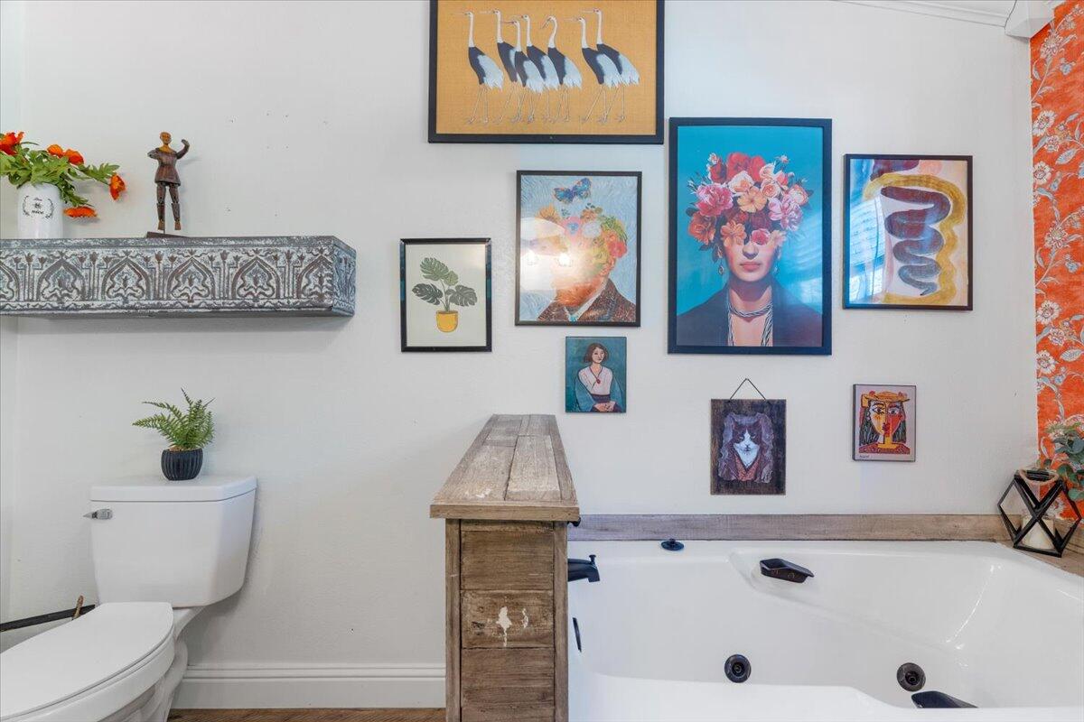 3562 Bob Tolbert Road Navarre, FL 32566 - Photo 21 of 55 a bathroom with a toilet a sink and a shower