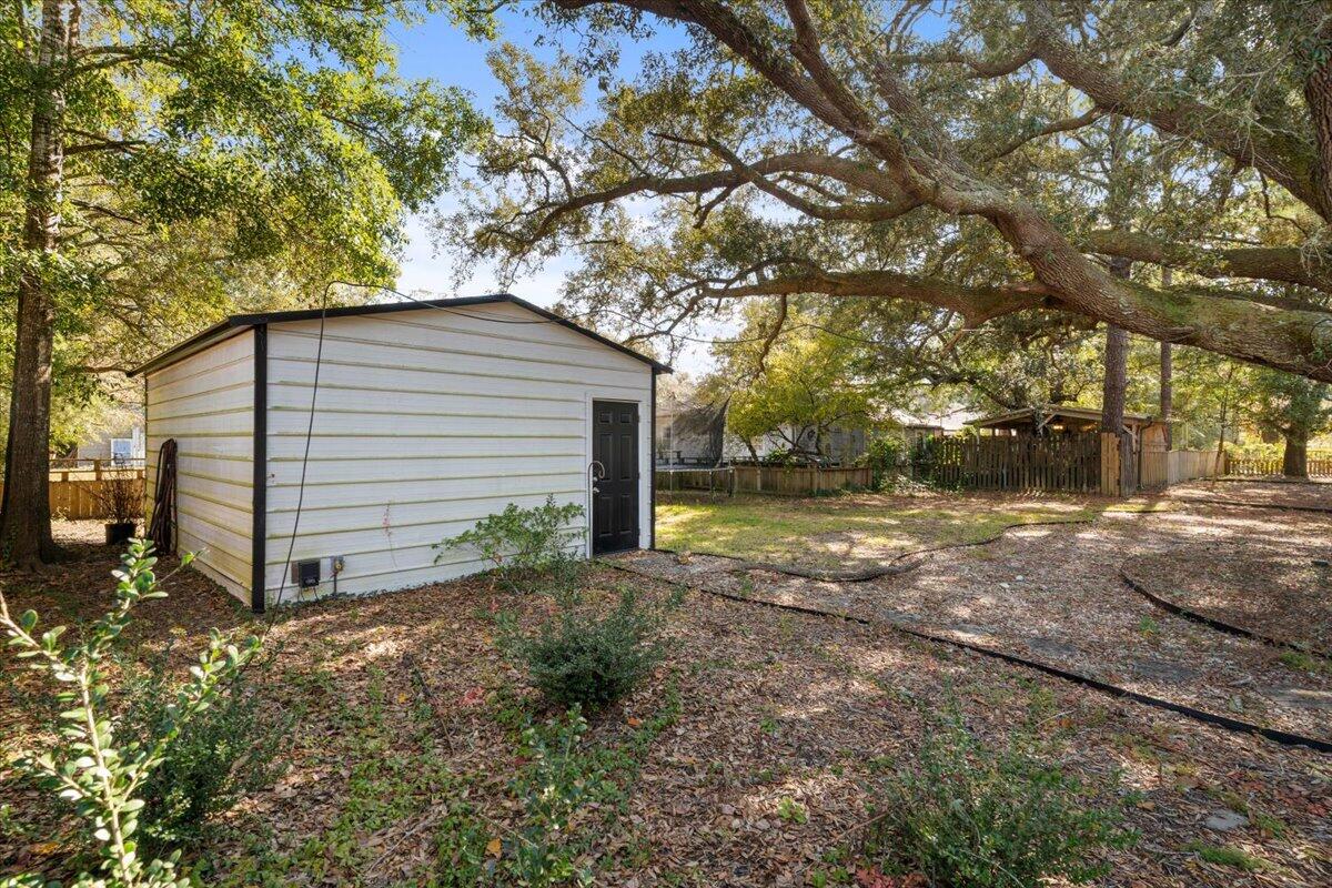 3562 Bob Tolbert Road Navarre, FL 32566 - Photo 35 of 55 a backyard of house with a trees