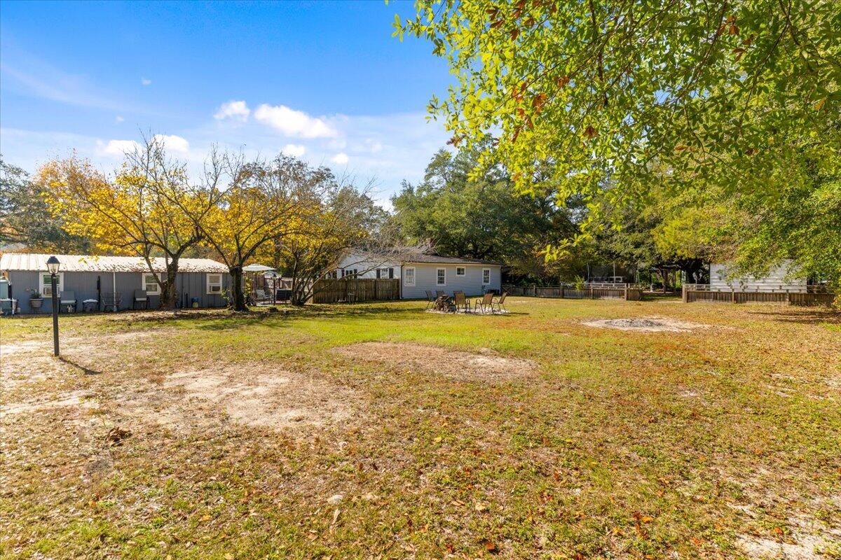 3562 Bob Tolbert Road Navarre, FL 32566 - Photo 36 of 55 a view of swimming pool with an outdoor space and seating area