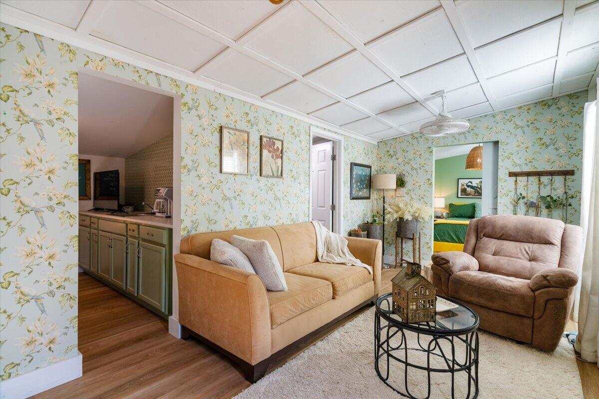 3562 Bob Tolbert Road Navarre, FL 32566 - Photo 39 of 55 a living room with furniture and wooden floor