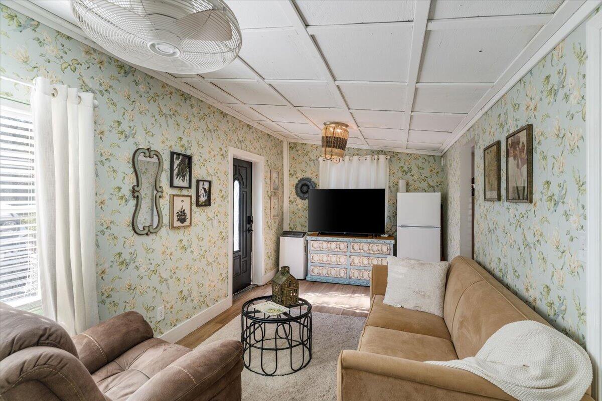 3562 Bob Tolbert Road Navarre, FL 32566 - Photo 41 of 55 a living room with furniture and a flat screen tv