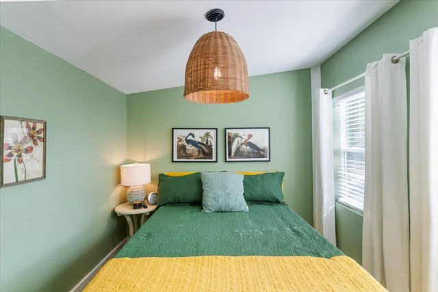 a view of a livingroom with furniture wooden floor and window