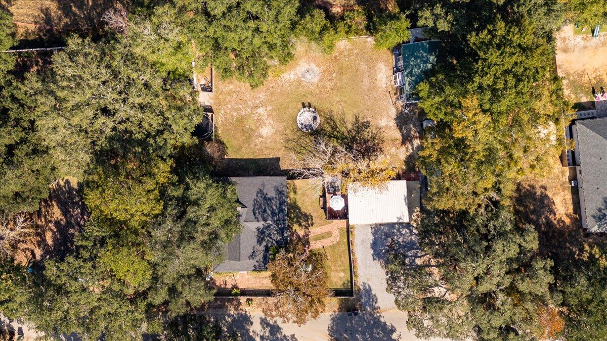 3562 Bob Tolbert Road Navarre, FL 32566 - Photo 50 of 55 a aerial view of a house with a yard and large trees