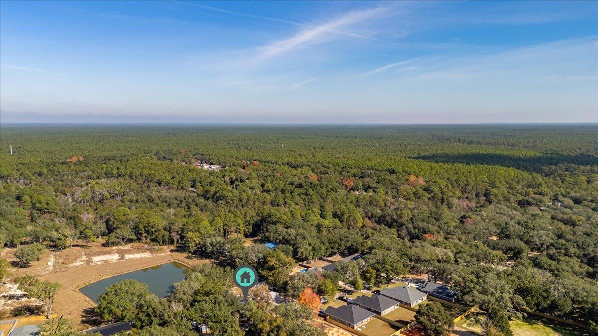 3562 Bob Tolbert Road Navarre, FL 32566 - Photo 52 of 55 an aerial view of residential houses with outdoor space